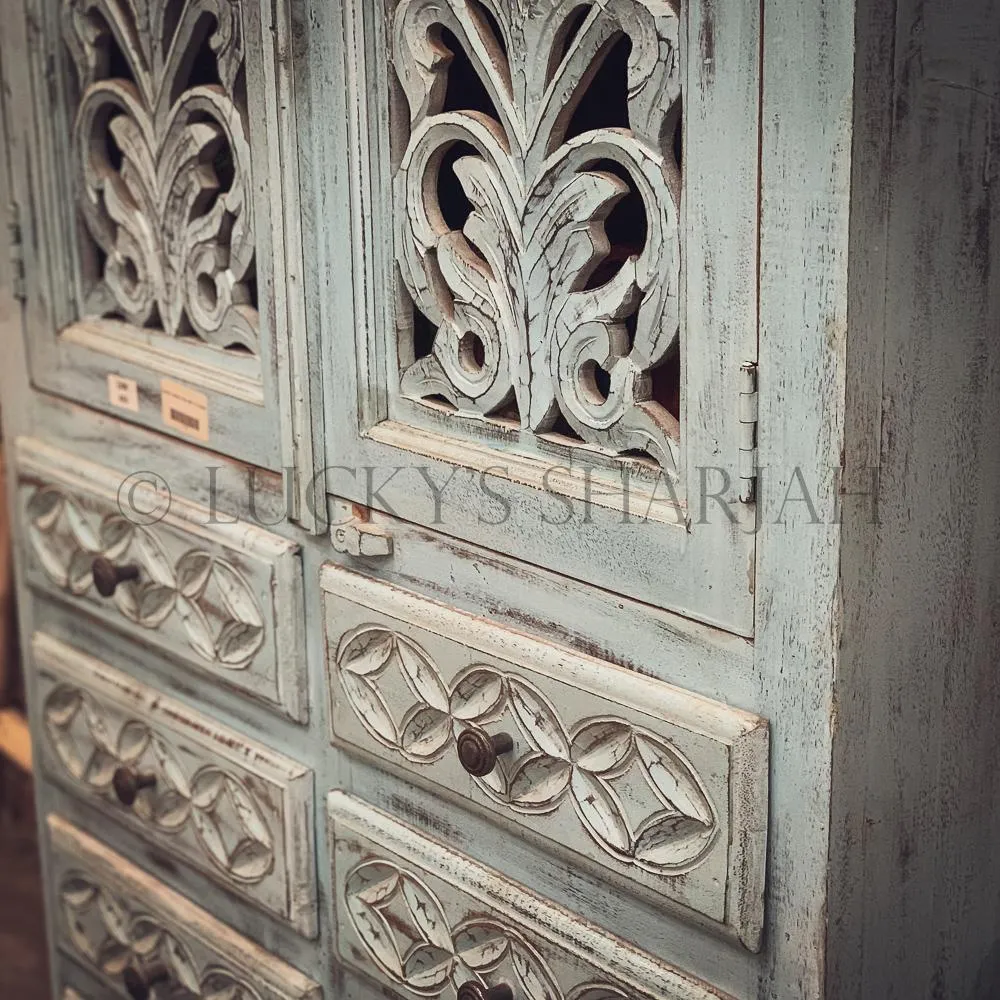 Carved sky blue cabinet with drawers